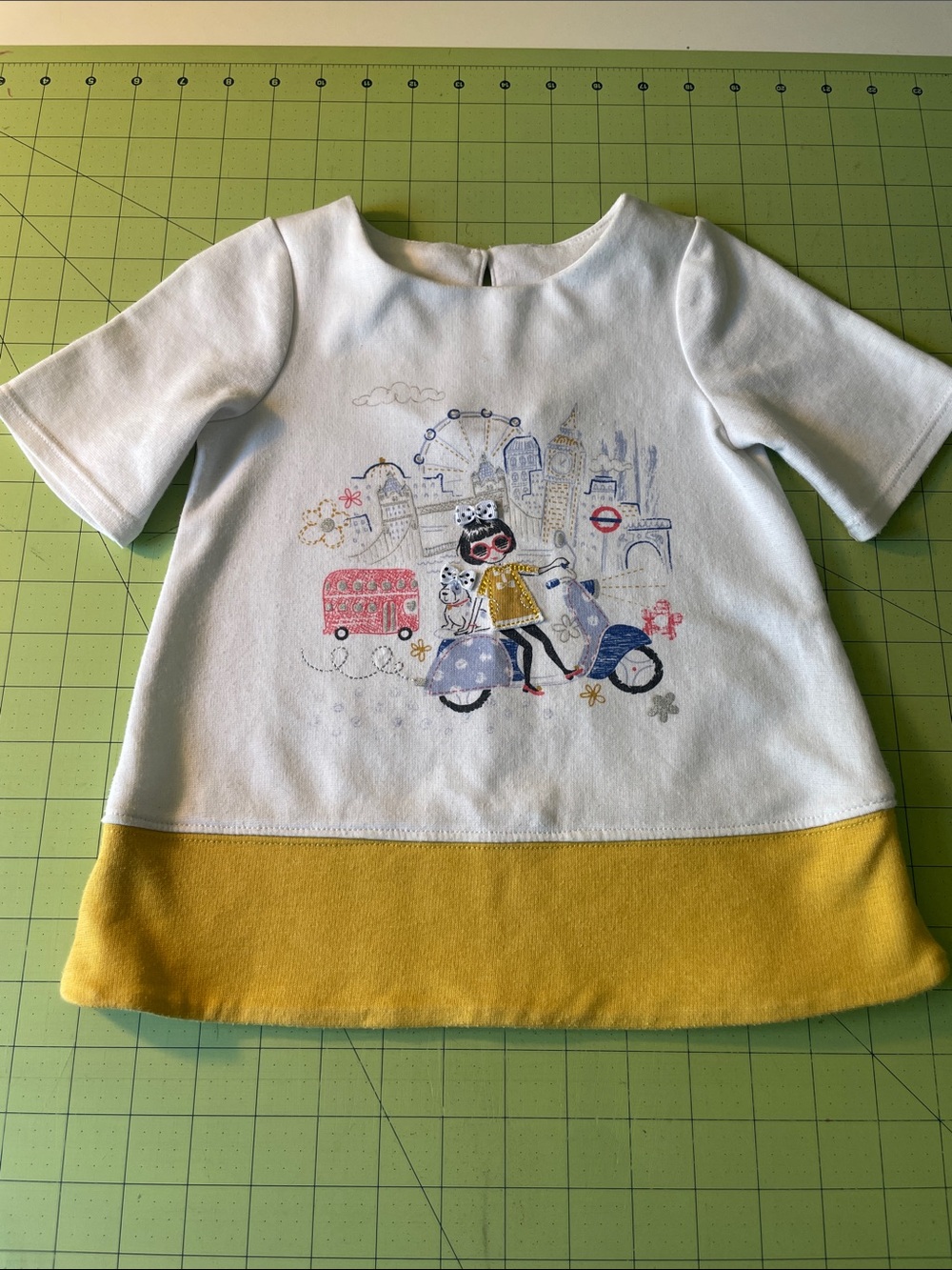 Maggie & Zoe White Tunic Top with Mustard Hem and London Graphic